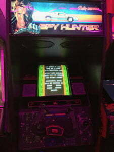 Spy Hunter's cabinet features a unique steering wheel.