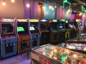 The largest room features arcade machines down one wall.